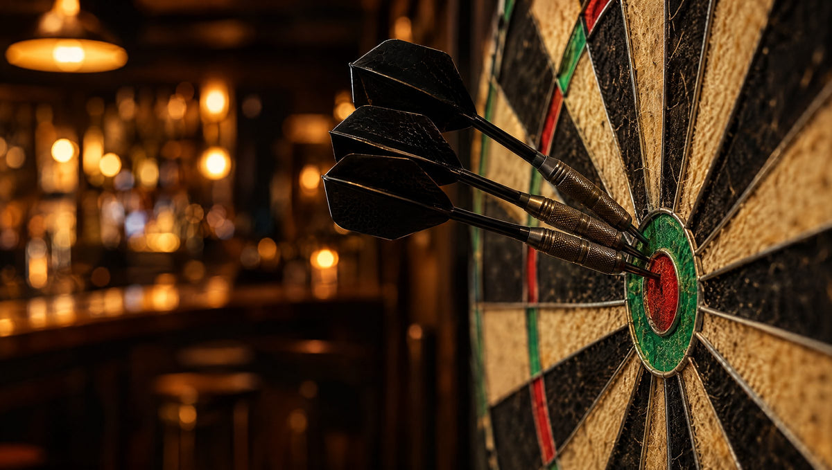 Steel tip darts in a dartboard in a warm pub-style game room